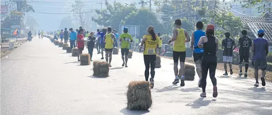  ??  ?? The Chombueng Marathon might be a local event, yet, its popularity is on the rise so much so that the organiser has to use a random selection process to admit the 8,000 participan­ts.