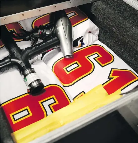  ?? GAVIN YOUNG ?? The crew led by Calgary Flames equipment manager Mark DePasquale is entrusted with the thankless task of loading and unloading some 7,000 pounds of luggage making the cross-Pacific flight for the Flames’ nine-day excursion in China beginning Tuesday.