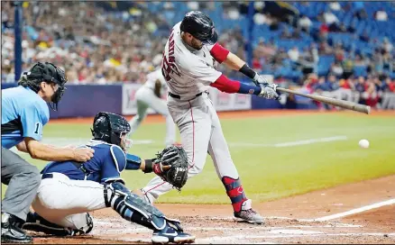  ??  ?? Boston Red Sox’s J.D. Martinez connects for a two-run double off Tampa Bay Rays pitcher Ryan Yarbrough during the third inning of a baseball game, on June 22, in St. Petersburg, Florida. (AP)