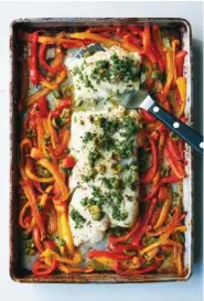  ?? DAVID MALOSH/THE NEW YORK TIMES ?? Sheet-pan roasted fish with sweet peppers delivers a whole meal in a single dish.