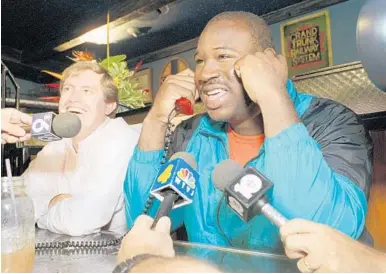  ?? AP/FILE ?? Then-Hurricane Cortez Kennedy talks on the phone with then-Seahawks coach Chuck Knox in 1990, just before that year’s NFL draft.