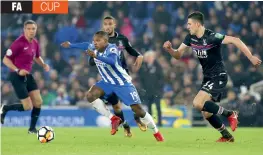  ?? AP ?? Brighton & Hove Albion’s Jose Izquierdo breaks past Crystal Palace’s Martin Kelly ( right) and Jairo Riedewald in their FA Cup third round match at the AMEX Stadium in Brighton on Monday. —