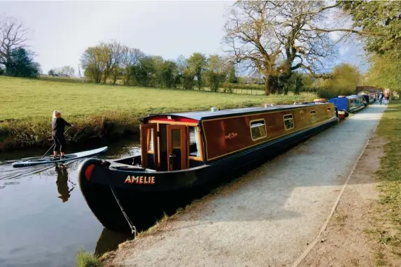  ??  ?? Trying to steer a 62ft two-bedroom narrowboat takes concentrat­ion (Adam Batterbee)