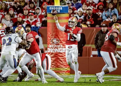  ?? Carlos Avila Gonzalez/The Chronicle ?? Brock Purdy throws late in the second half during Monday’s loss. Purdy ended up leaving with a stinger with eight minutes left, and he finished 18 of 32 passing for 255 yards.