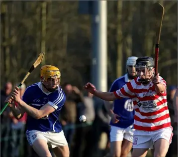  ??  ?? Damien Reck of Oylegate-Glenbrien about to clear as Niall Murphy (Ferns) attempts the block.