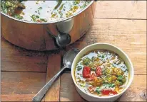  ?? AP PHOTO ?? Escarole and spinach soup. To make the soup more substantia­l, you can add a can of rinsed and drained white beans, such as navy or cannellini.