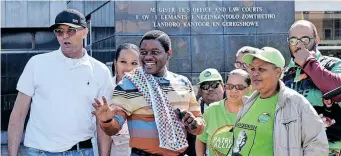  ?? ?? BONGINKOSI Khanyile, centre, who has been charged with instigatin­g violence and taking part in the July unrest, appeared at the Durban High Court, and had Patriotic Alliance supporters backing him. | Tumi Pakkies African News Agency (ANA)