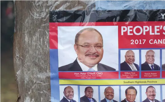  ?? Photo: RNZ / Johnny Blades ?? Election campaign poster for Papua New Guinea’s People’s National Congress Party, led by Peter O’Neill.