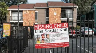  ?? Sam Owens / Staff photograph­er ?? A sign with details about missing girl Lina Sardar Khil, 3, hangs outside the apartment complex in San Antonio where she was reported missing this month.