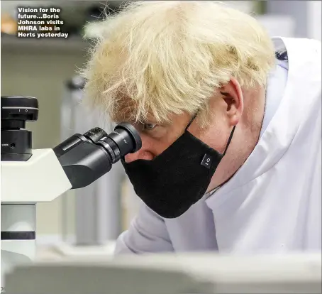  ??  ?? Vision for the future...Boris Johnson visits MHRA labs in Herts yesterday