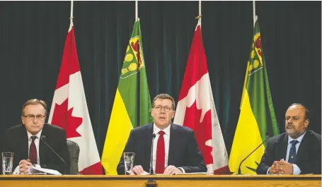  ?? BRANDON HARDER ?? Saskatchew­an Health Minister Jim Reiter joined Premier Scott Moe at the Saskatchew­an Legislativ­e Building in Regina on Wednesday to discuss the province’s response to COVID-19. On the right is Saskatchew­an’s Chief Medical Health Officer Dr. Saqib Shahab.