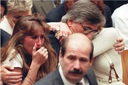  ?? Photograph: Myung J Chun/AP ?? Fred Goldman hugs his wife, Patti, as his daughter, Kim, reacts to the not-guilty verdicts in OJ Simpson’s double-murder trial on 3 October 1995.