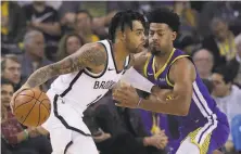  ?? Jeff Chiu / Associated Press 2018 ?? Russell drives against the Warriors’ Quinn Cook in November. Russell now is with the Warriors. Cook has joined the Lakers.