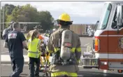  ??  ?? Emergency medical services personnel transfer an accident victim to a waiting helicopter Saturday afternoon following a multi-vehicle accident on Radio Station Road in La Plata. One of the victims subsequent­ly died of his injuries.