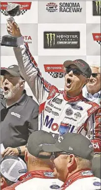  ?? GETTY ?? Kevin Harvick celebrates in victory lane after winning NASCAR’s Toyota/Save Mart 350 at Sonoma, Calif., Raceway.