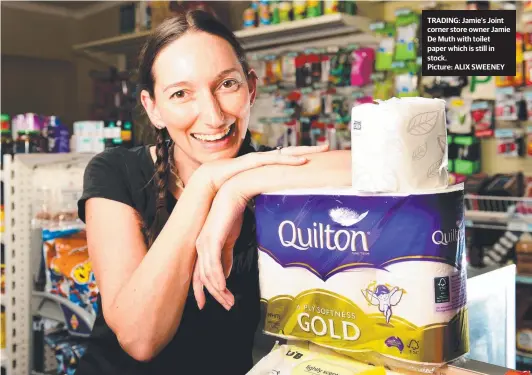  ?? Picture: ALIX SWEENEY ?? TRADING: Jamie’s Joint corner store owner Jamie De Muth with toilet paper which is still in stock.