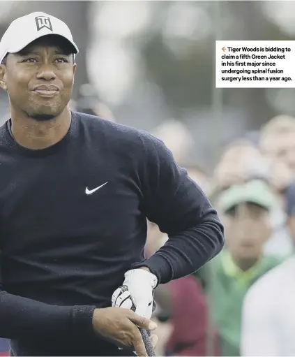  ??  ?? 2 Tiger Woods is bidding to claim a fifth Green Jacket in his first major since undergoing spinal fusion surgery less than a year ago.