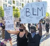  ?? BRIAN CASSELLA/CHICAGO TRIBUNE ?? Protesters rally during a demonstrat­ion on Division Street on June 2, 2020, following the death of George Floyd and others in police custody.