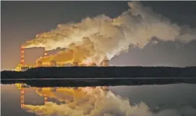  ?? AP FILE PHOTO/CZAREK SOKOLOWSKI ?? Clouds of vapor drift over Europe’s largest lignite power plant in Belchatow, Poland.