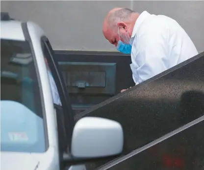  ?? JONATHON GRUENKE/STAFF ?? Former Norfolk Sheriff Bob McCabe is escorted out of the U.S. District Court building in custody after being found guilty in August on all 11 charges in a federal corruption trial.