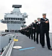  ??  ?? Enthusiast­ic crowds turned out in force. Above: sailors on board at Portsmouth. Left: Theresa May speaking from the flight deck