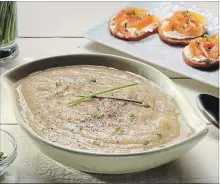  ??  ?? Cauliflowe­r soup is served with smoked salmon toasts, inspired by a French bistro’s version.