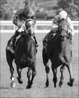  ?? KEENELAND/COADY PHOTOGRAPH­Y ?? Dickinson (left) defeats Lady Eli in the Jenny Wiley at Keeneland. The two will renew acquaintan­ces in the Grade 1 Diana.