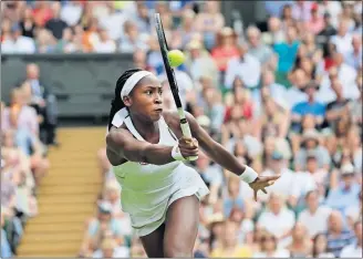  ?? [BEN CURTIS/THE ASSOCIATED PRESS] ?? Coco Gauff, 15, returns the ball to Polona Hercog during Friday’s match at Wimbledon.