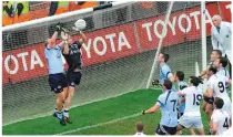  ?? SPORTSFILE ?? Shane Ryan and Dublin goalkeeper Stephen Cluxton combine to stop a late Kildare free in a dramatic end to the 2009 Leinster final. Above: lining out at midfield against Tyrone in 2008