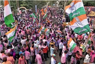  ?? PTI ?? Congress Party workers celebrate after party candidate Anand Siddu Nyamagouda defeated his BJP rival Srikant Kulkarni in the Jamkhandi assembly by-election on Tuesday. —