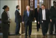  ?? J. SCOTT APPLEWHITE — THE ASSOCIATED PRESS ?? Senate Majority Leader Mitch McConnell, R-Ky., walks from the chamber to his office Thursday during a long series of votes at the Capitol in Washington.