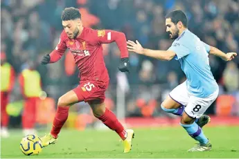  ?? AFP photo ?? Liverpool deserve to be awarded the Premier League title even if the season is cancelled, says Manchester City star Ilkay Gundogan (R). -