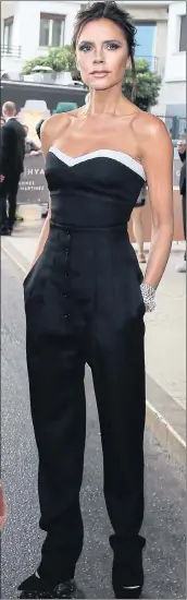  ??  ?? Victoria Beckham in her trendy black slacks