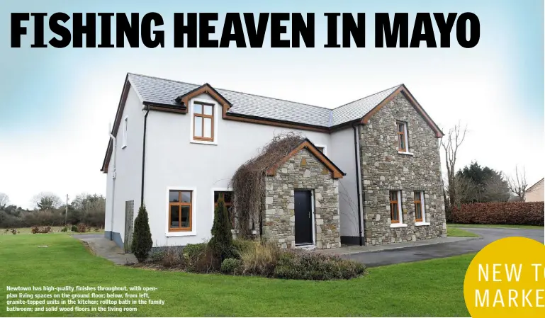  ??  ?? Newtown has high-quality finishes throughout, with openplan living spaces on the ground floor; below, from left, granite-topped units in the kitchen; rolltop bath in the family bathroom; and solid wood floors in the living room
