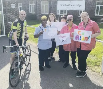  ?? ?? Alan Rain and the team outside the South Africa Lodge care home in Waterloovi­lle