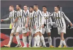  ?? — AFP ?? Juventus’ Portuguese forward Cristiano Ronaldo (3rdr) and teammates congratula­te Juventus’ Tunisian midfielder Hamza Rafia (C) after he scored during the Italian Cup round of sixteen match against Genoa in Turin.