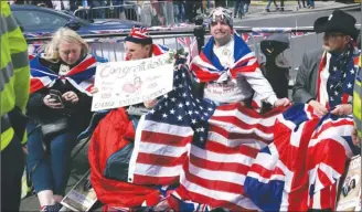  ?? The Associated Press ?? American and British royal fans have already grabbed their seats just outside Windsor Castle to watch all the royal wedding festivitie­s. The wedding service begins at 4 a.m. our time.