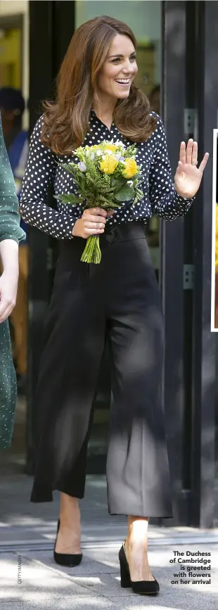  ??  ?? The Duchess of Cambridge is greeted with flowers on her arrival