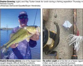  ?? (Arkansas Democrat-Gazette/Bryan Hendricks) (Arkansas Democrat-Gazette/Bryan Hendricks) ?? Stephen Browning (right) and Ray Tucker break for lunch during a fishing expedition Thursday in Nevada County. Stephen Browning admires one of the bigger bass caught despite difficult fishing conditions.