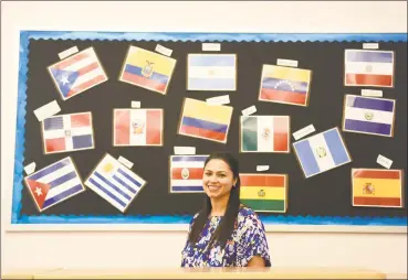  ?? Tyler Sizemore / Hearst Connecticu­t Media ?? Jessica Maxán poses in her classroom at Western Middle School in Greenwich. Maxán received a grant for profession­al developmen­t and immersed herself in Peruvian culture to advance how Spanish is taught.