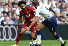  ?? AFP ?? Mohamed Salah ( left) of Liverpool looks to run past Tottenham Hotspur’s Belgian defender Jan Vertonghen during their English Premier League match at the Wembley Stadium in London in this file picture. —