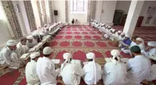  ?? FILE PHOTO ?? Students engaged in study inside a madrasa.