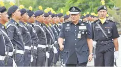  ??  ?? Khalid inspecting the guard of honour yesterday.