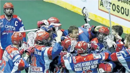  ?? CLIFFORD SKARSTEST/EXAMINER ?? The Peterborou­gh Century 21 Lakers celebrate their series-ending victory against the Six Nations Chiefs during Game 5 of the Major Series Lacrosse championsh­ip series on Thursday night at the Memorial Centre. The Lakers now face the host New...