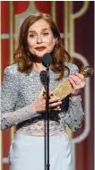  ??  ?? Isabelle Huppert accepting the award for best actress in a motion picture drama for her role in "Elle".