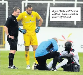  ??  ?? Ryan Clarke watches on as Kevin Amankwaah is forced off injured