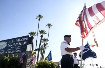  ??  ?? Honour guard David Carrasco, 78, of Phoenix, Arizona stands with the flag outside the AL Moore-Grimshaw Mortuary in Phoenix, Arizona where the body of McCain is being held. — AFP photo