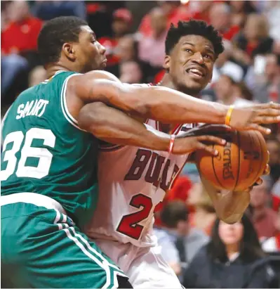  ?? | CHARLES REX ARBOGAST/ AP ?? Jimmy Butler ( right) will see Marcus Smart againWedne­sday after their public comments about each other.