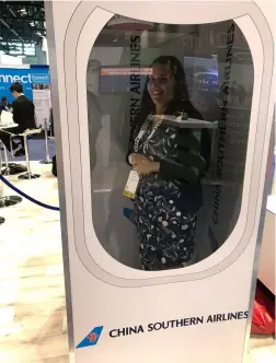  ?? PHOTO: © KIMBERLY KROL INLANDER ?? Flight of Fancy:
Kimberly having some fun at the China Southern Airlines booth at GBTA