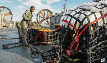  ?? U.S. Navy/Getty Images ?? Sailors prepare material recovered in the Atlantic Ocean from a high-altitude balloon Feb.10 for transport to federal agents at Joint Expedition­ary Base Little Creek.